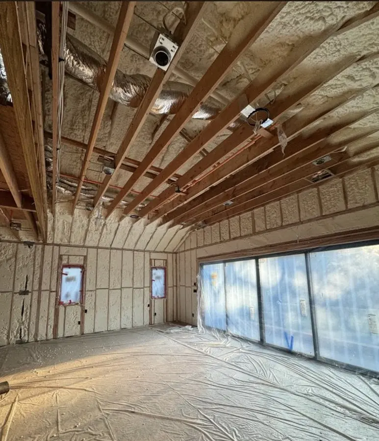 Interior walls and ceiling insulated with spray foam during new construction in Pelham
